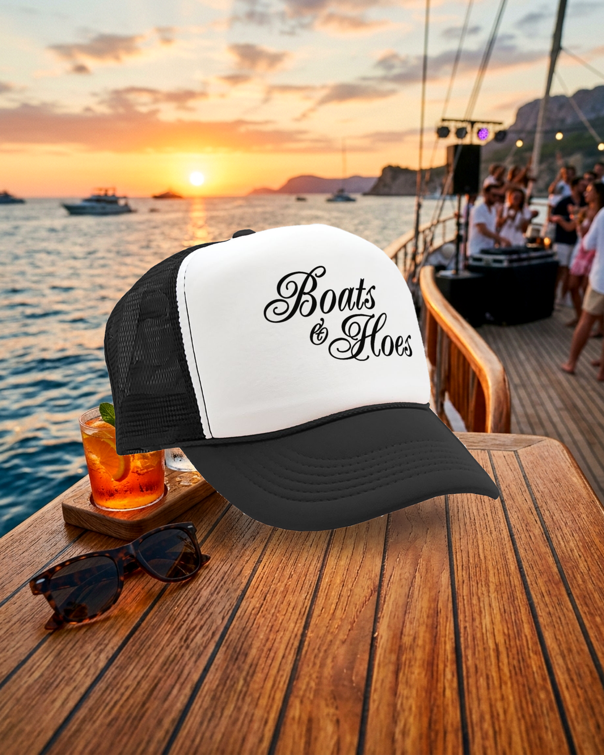 Boats & Hoes retro trucker hat as hero on a boat deck at golden hour